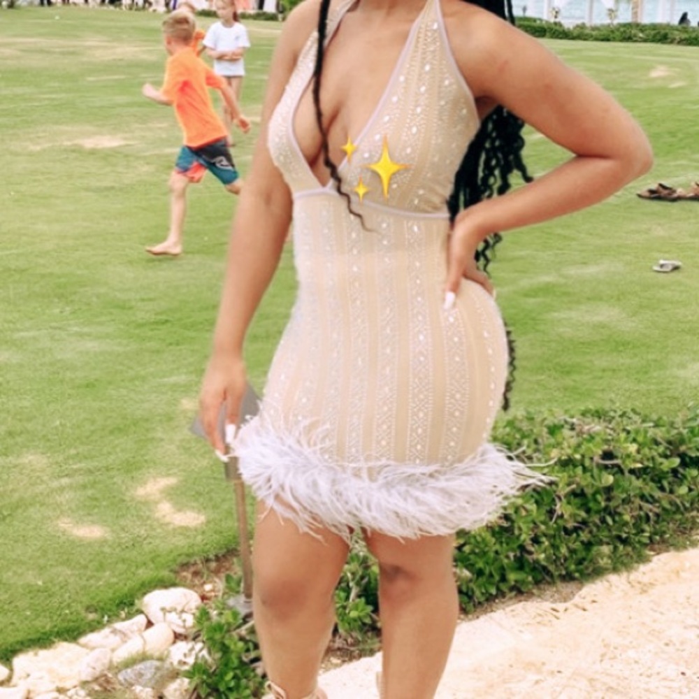 Glamour dress with feathers at the bottom